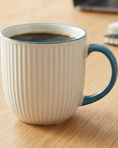 Modha Ribbed Porcelain Mug 420 ml Cream and Teal - Lifestyle view